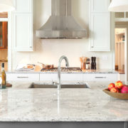 veined Cambria countertops with white cabinets and stainless appliances | Marchand Creative Kitchens Cabinets New Orleans Metairie Mandeville LA