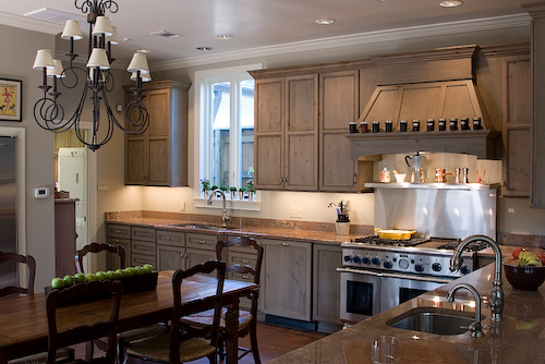 Kitchen Remodel with grey cabinets, hood, stainless stove range | Marchand Creative Kitchens Cabinets New Orleans Metairie Mandeville LA