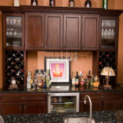 dark wood cabinets and wet bar | Marchand Creative Kitchens Cabinets New Orleans Metairie Mandeville LA