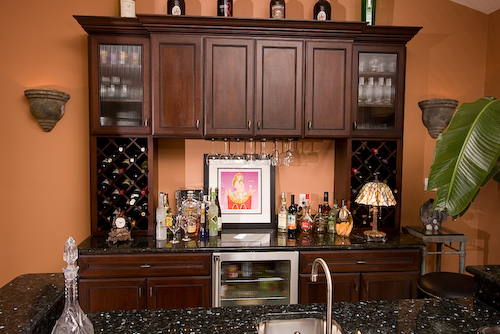 dark wood cabinets and wet bar | Marchand Creative Kitchens Cabinets New Orleans Metairie Mandeville LA