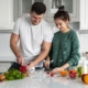 young-couple-cooking-home | Marchand Kitchens Metairie and Mandeville, LA