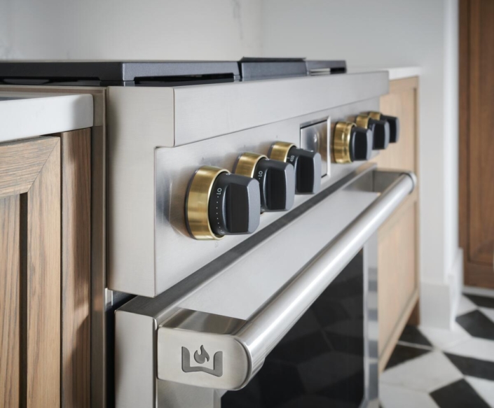 Wolf oven doors with black and gold knobs | Marchand Creative Kitchens