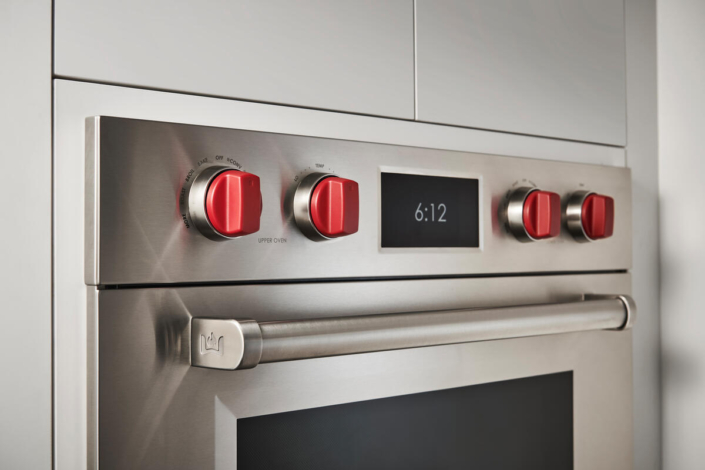 oven door with red knobs